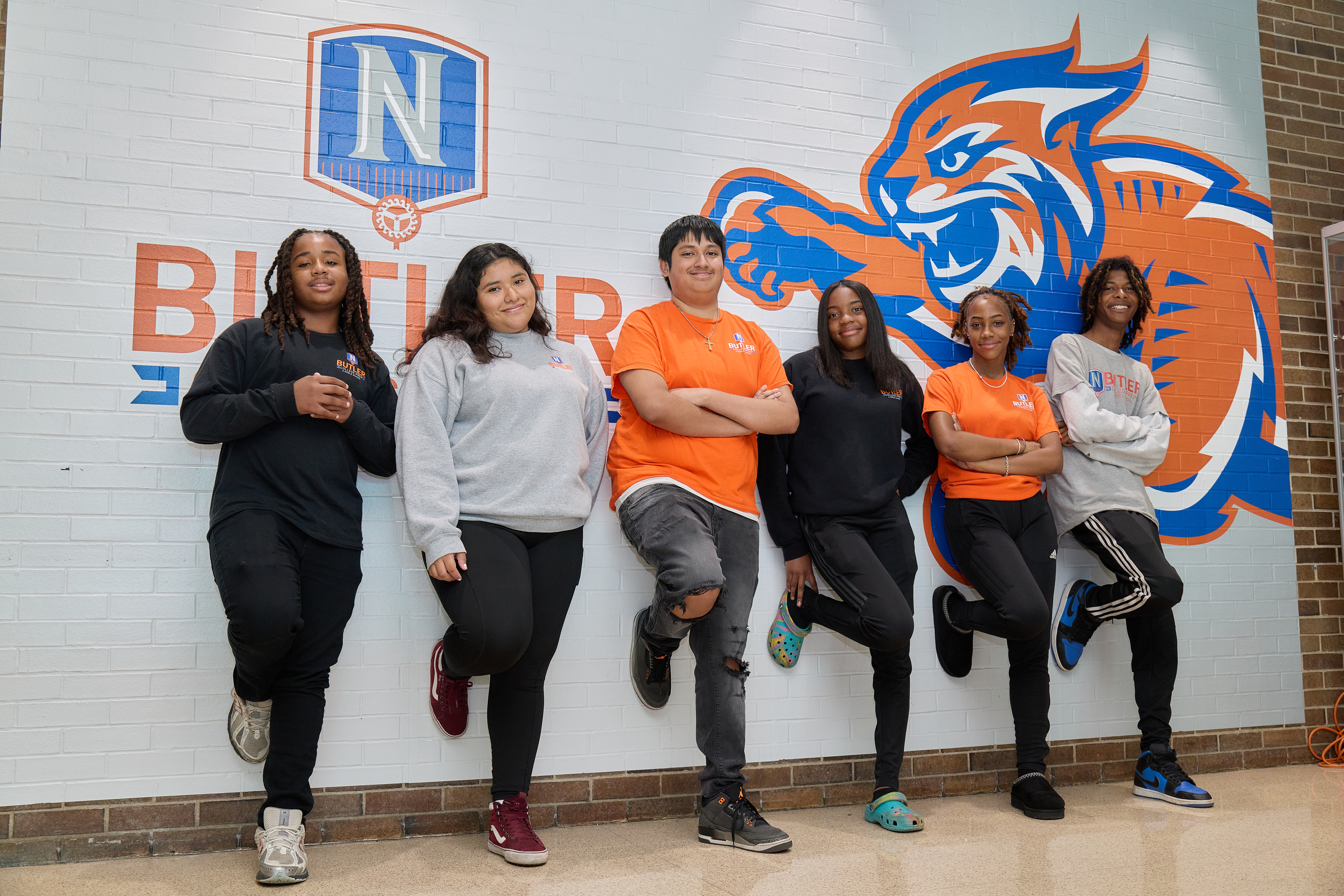 _LM_8310 Proud college prep students from Chicago Butler campus standing by the wall with the school mascot and logo
