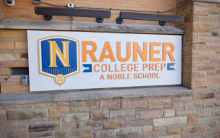 sign that reads "RAUNER COLLEGE PREP"